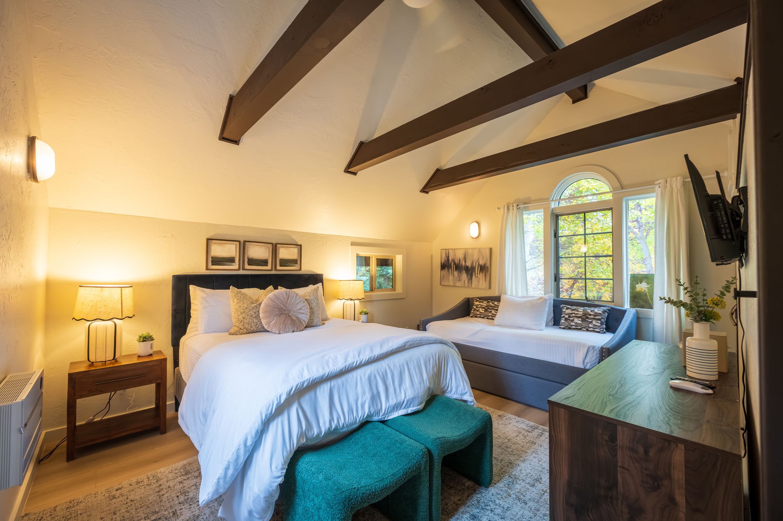 Cozy guest bedroom at River's Edge cabin in Crested Butte by Denver Hospitality, Travel & Tourism photographer Captain Colorado Photography.