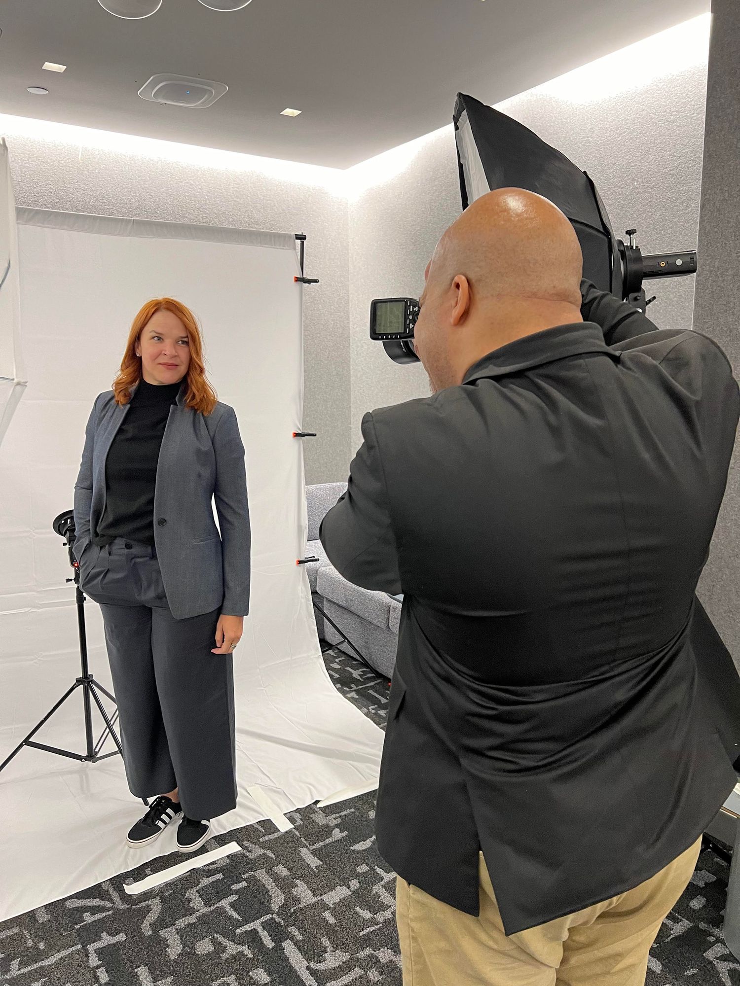 Headshot Photographer Kent Daniel photographing a businesswoman