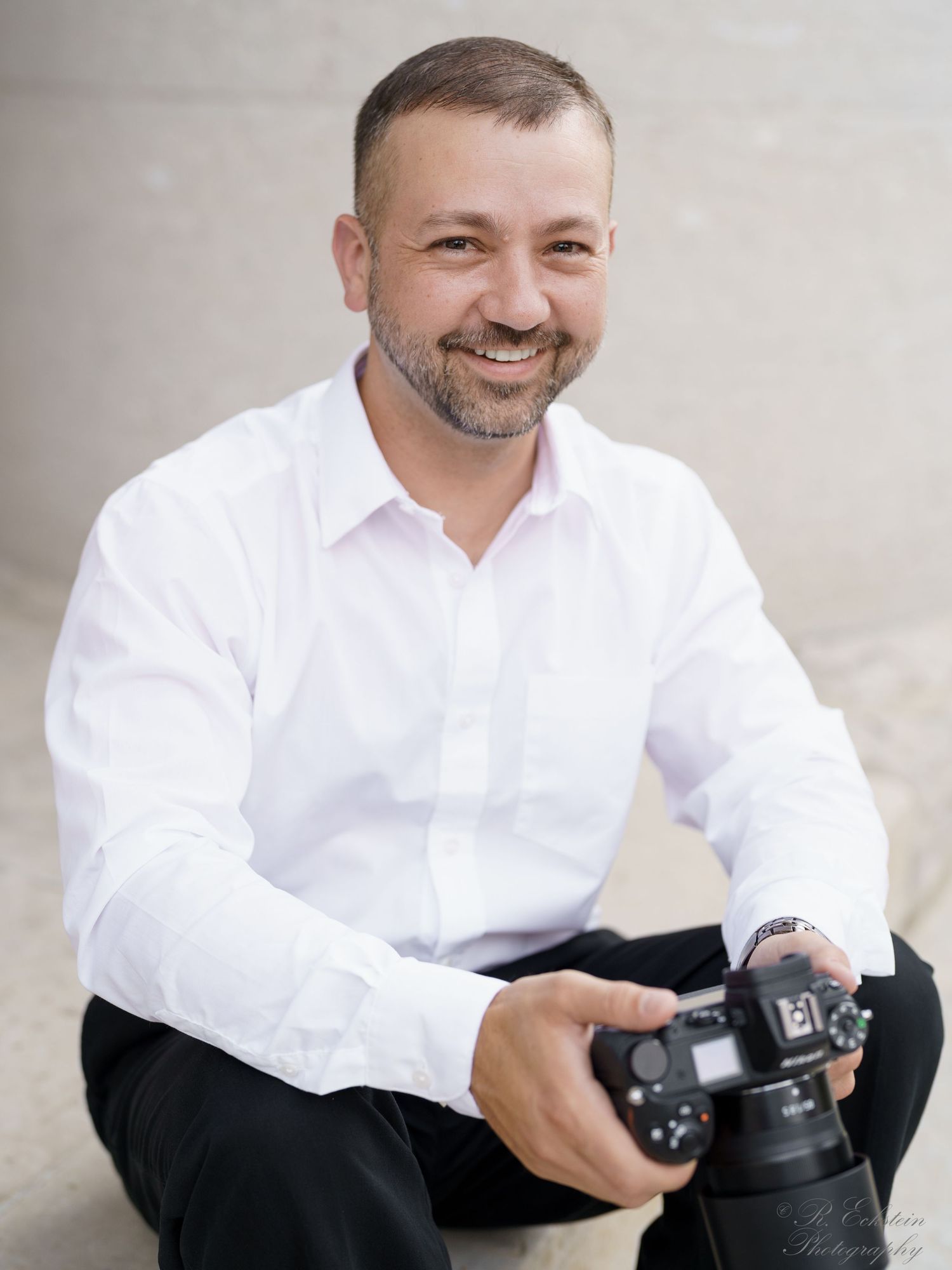 Portrait holding a camera