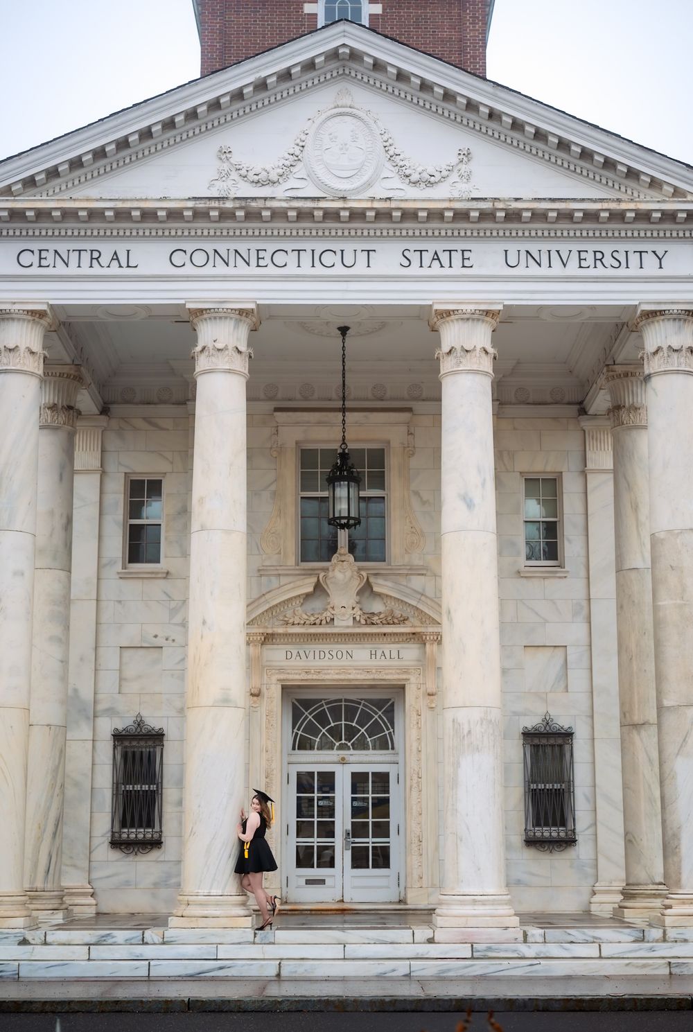 Exterior view of Central Connecticut State University's Davidson Hall with white columns.