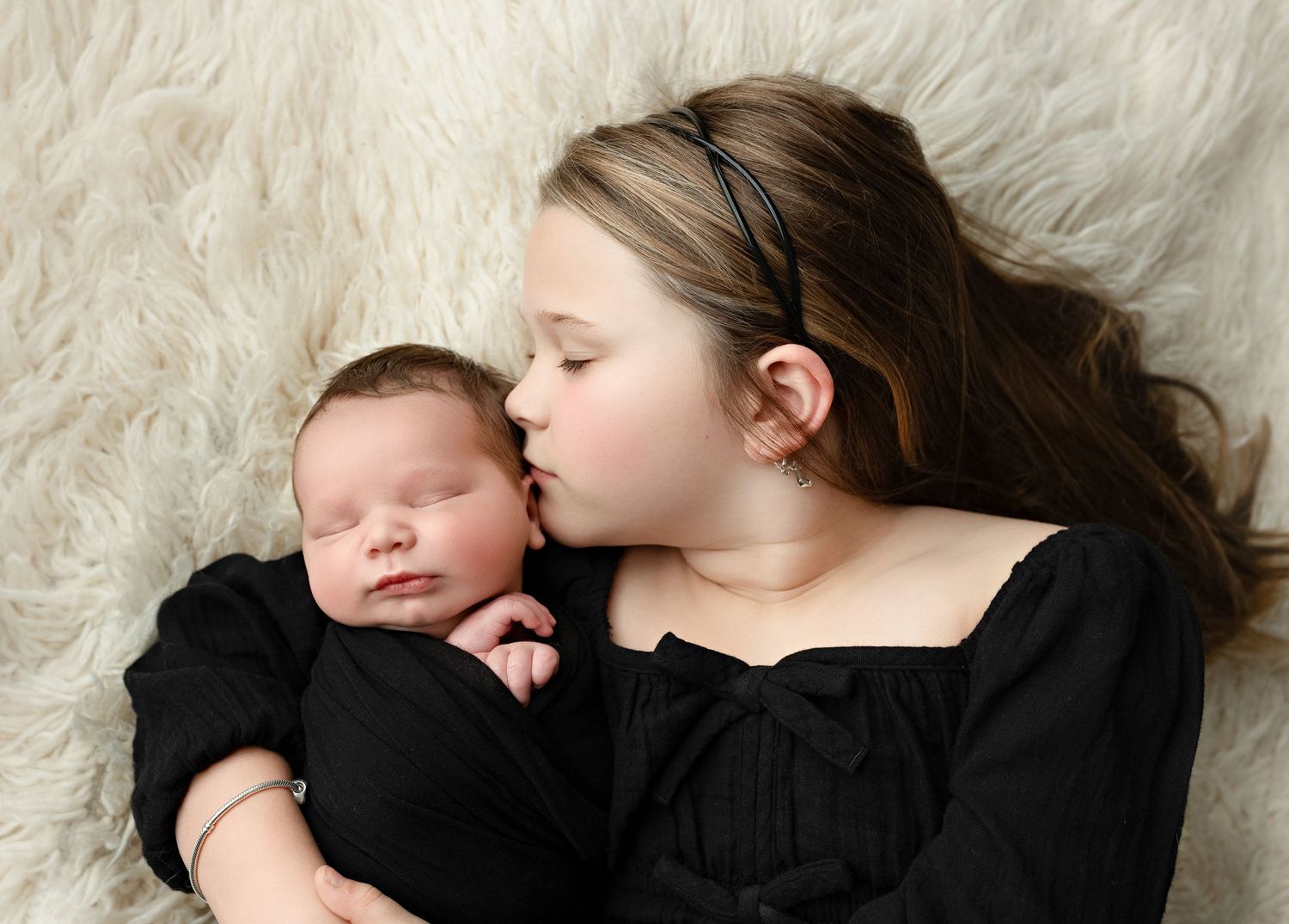 A big sister kissing her newborn brother. Greenville SC newborn photographer, Easley, SC newborn photographer, Upstate newborn photographer
