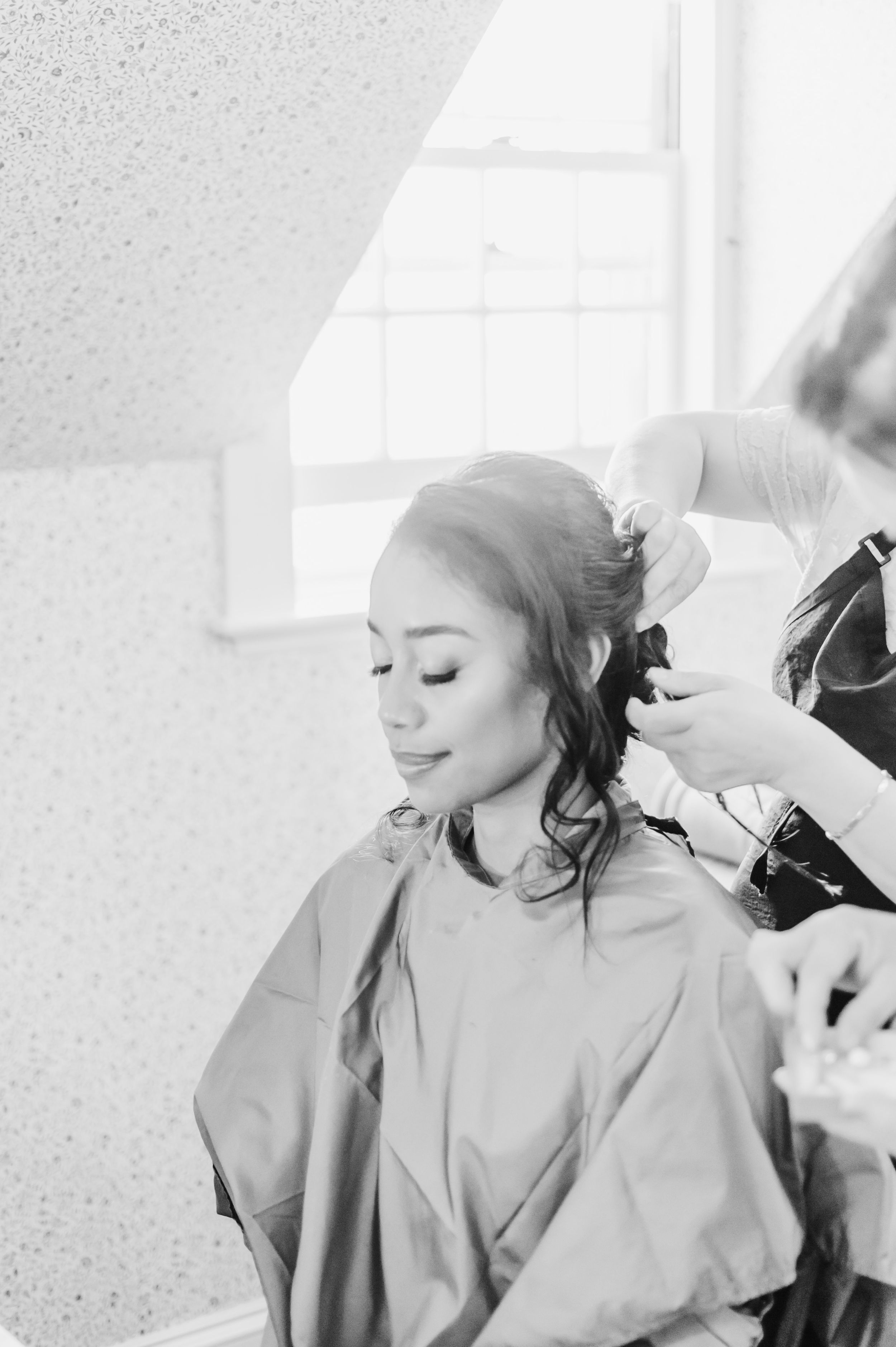 A serene behind-the-scenes moment during wedding day preparations.