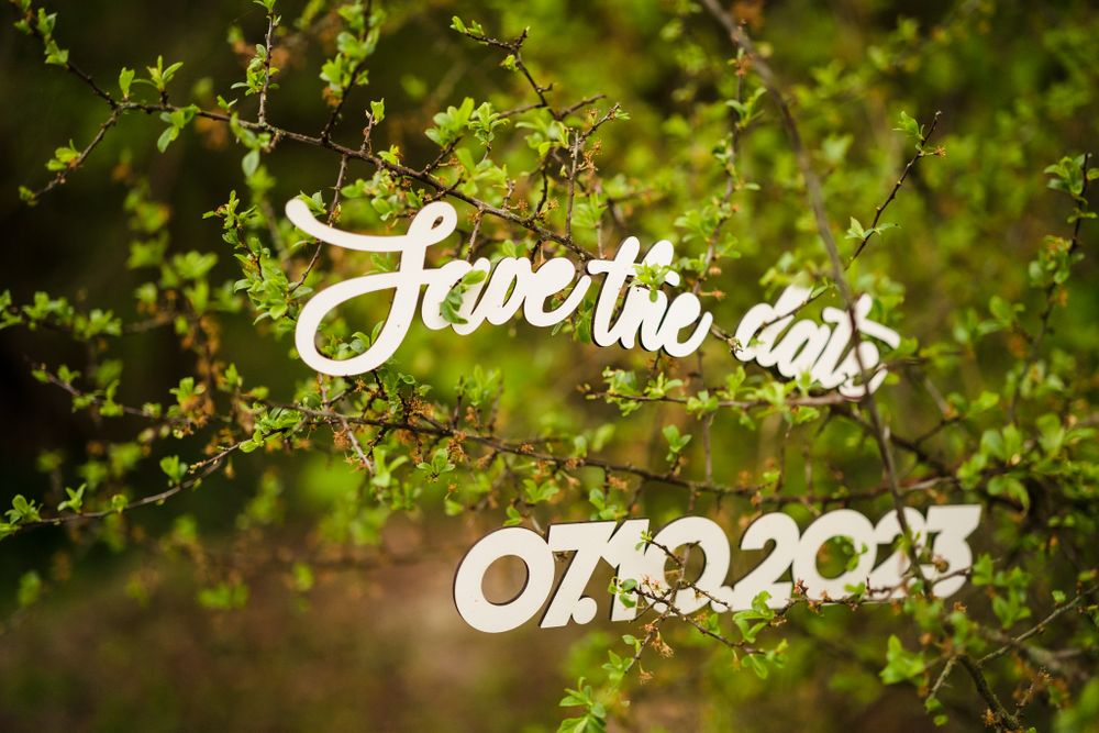 White decorative text overlaid on a blurred green natural background.