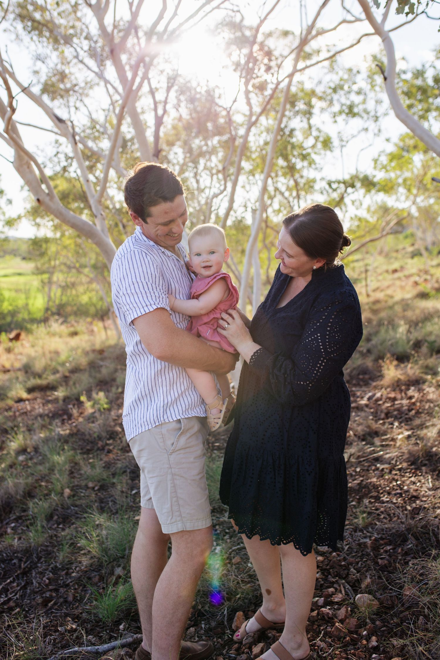 Mum and Dad holding baby during Cloncurry family photoshoot