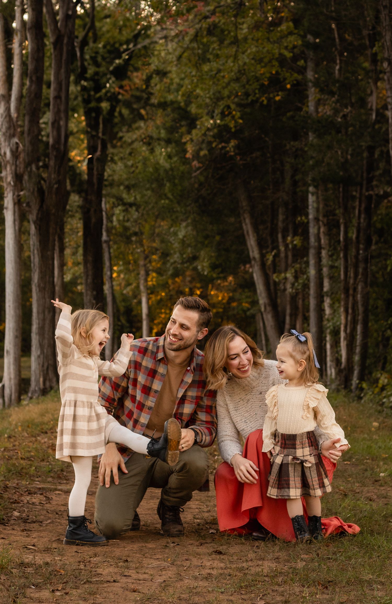 Charlottesville photographer, family, newborn, maternity, baby, family interacting against a fall wooded background