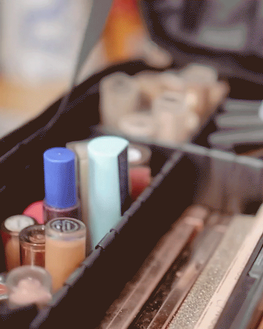 Makeup artist applying makeup on a woman