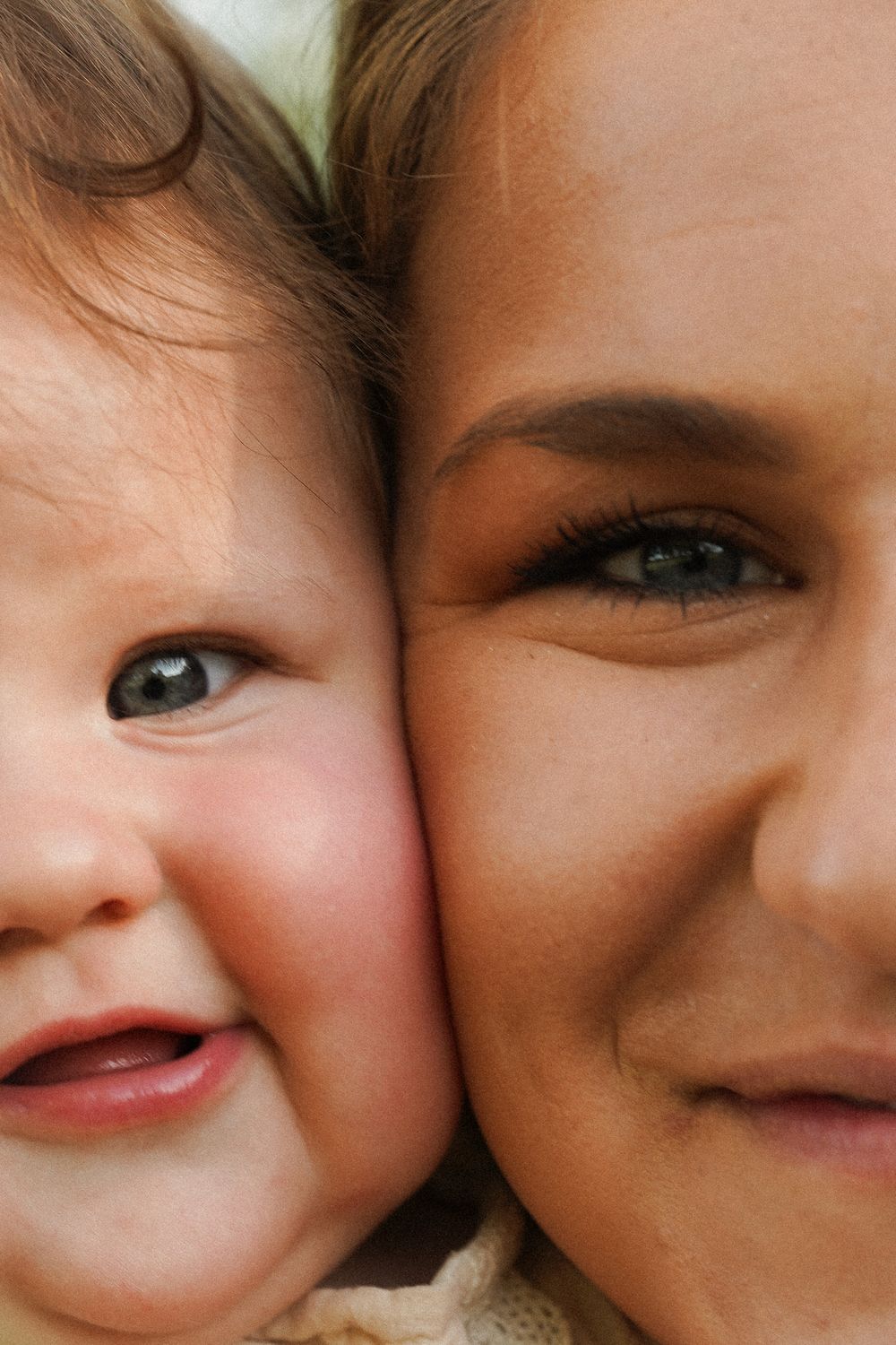 A close-up collage showing details of happy smiling faces with rosy cheeks.