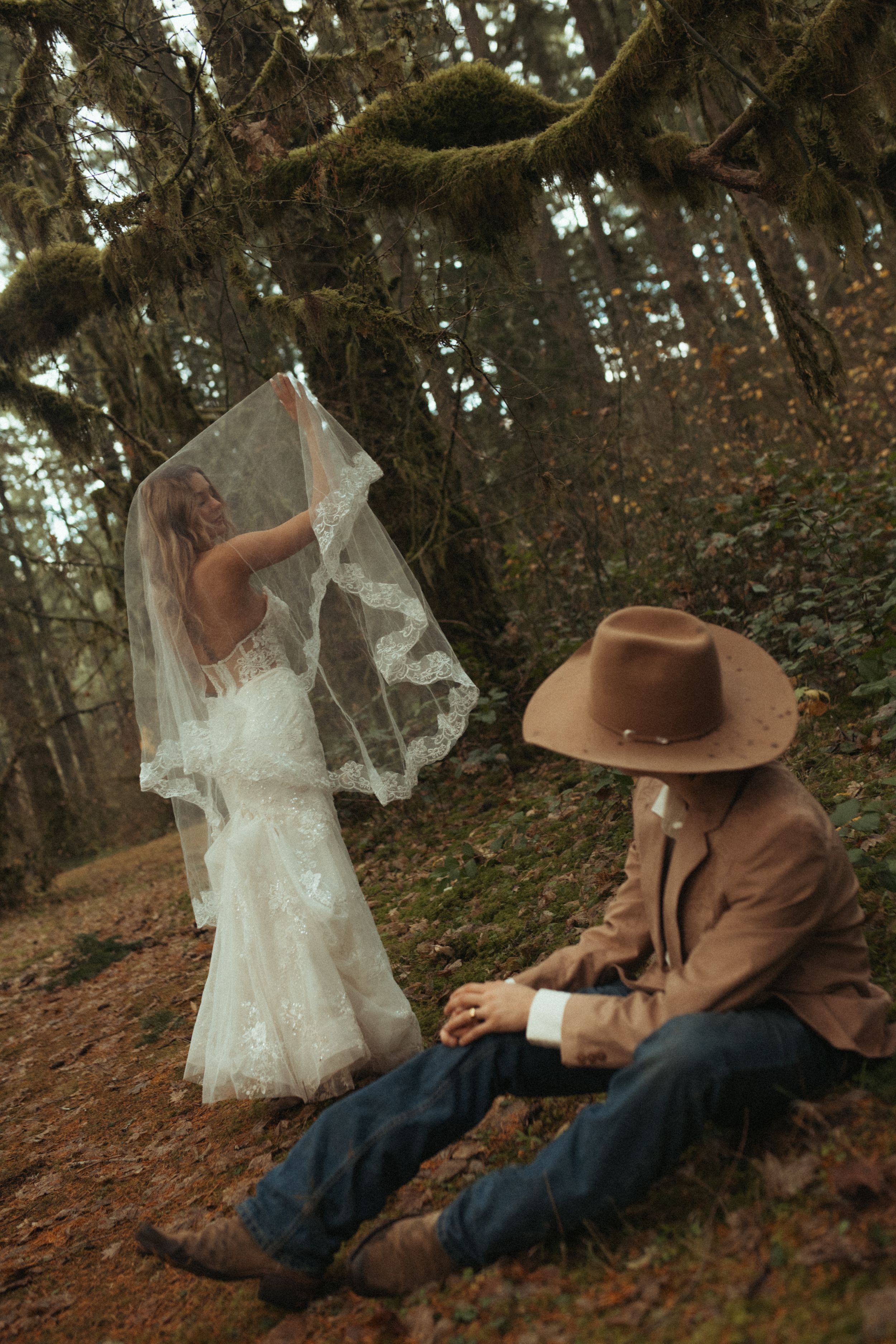 A sequence of images showing a ghostly white fabric floating near a person in a brown hat sitting against a tree in the forest.