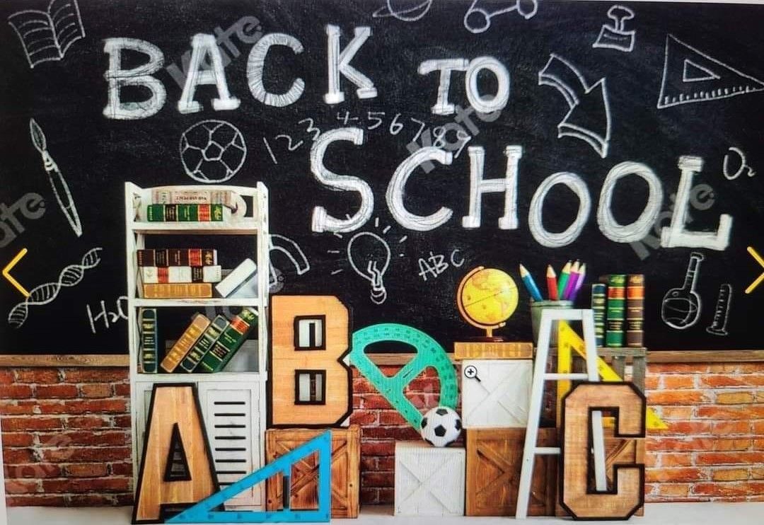 Back to school display with colorful alphabet blocks and educational items against chalkboard background.