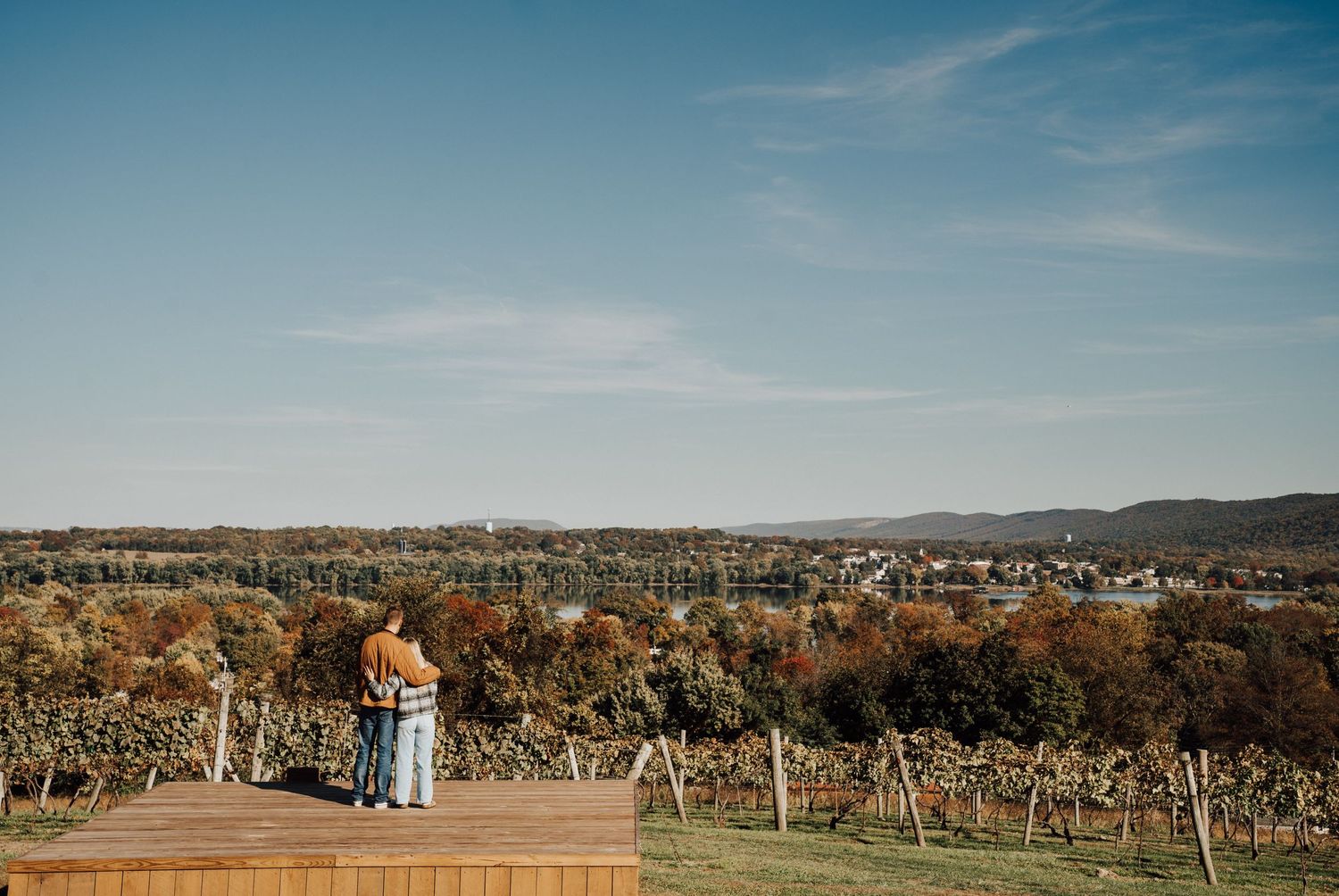 engaged couple looking at the view of The Winery at Hunters Valley