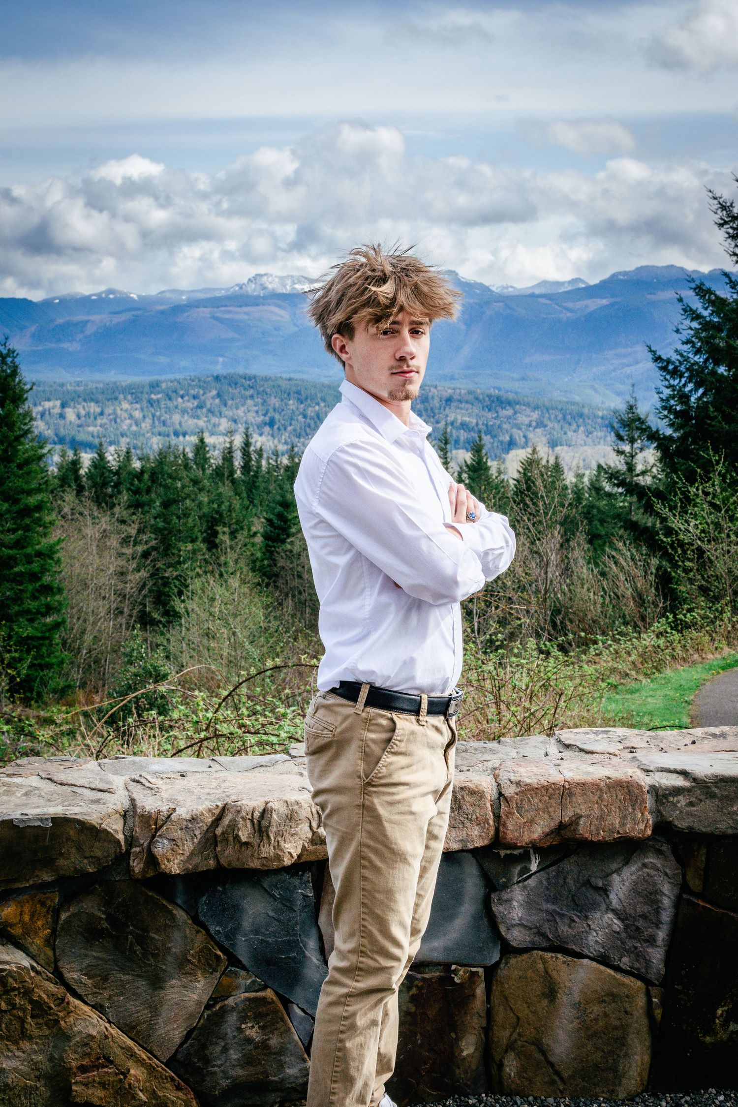 Seattle high school senior graduation photo at Snoqualmie Point Park, in a dress shirt and khaki slacks.