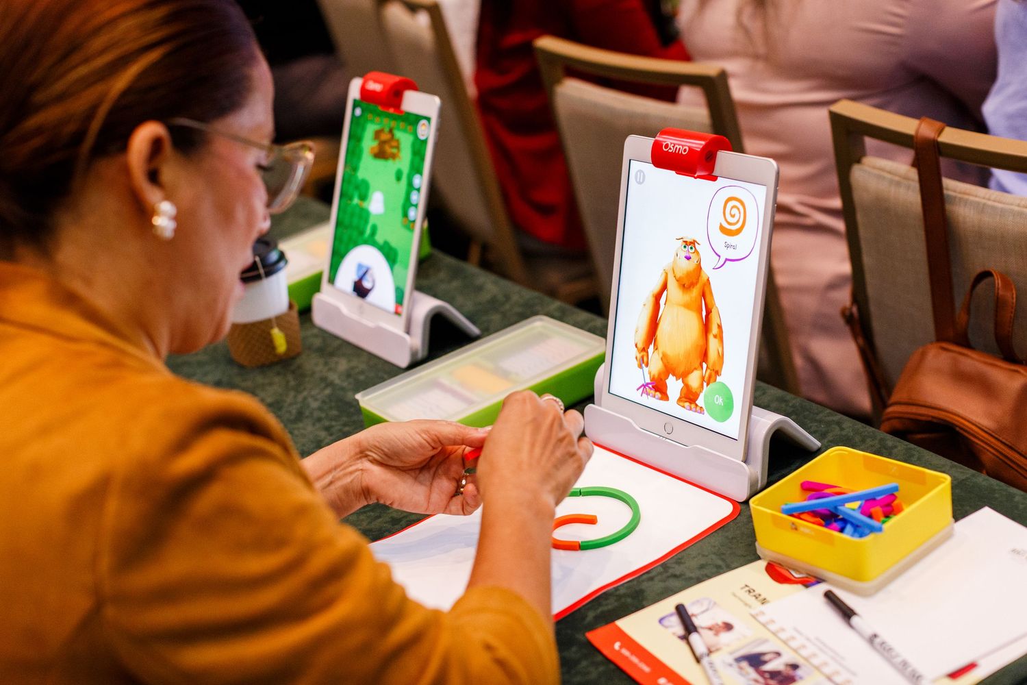 Teacher trying out educational tech at the Spring Educators Conference held at the Wyndham Grand Rio Mar in Rio Grande, Puerto Rico.