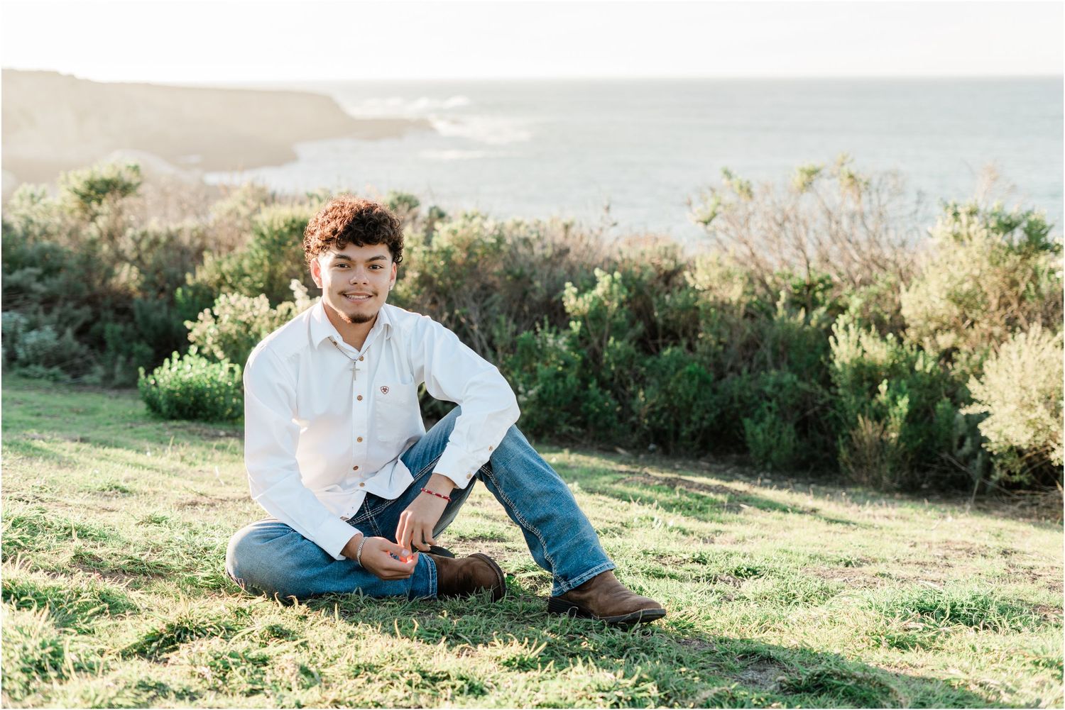 SLO High senior guy portrait with coastal cliffs, beach views, and natural scenery in San Luis Obispo County.