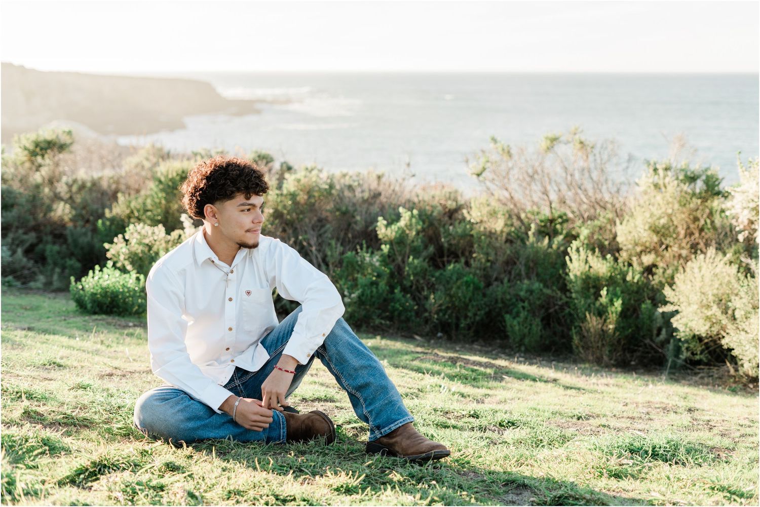 Senior guy photos along the rocky coastline and beach at Montana de Oro by a SLO High senior photographer.