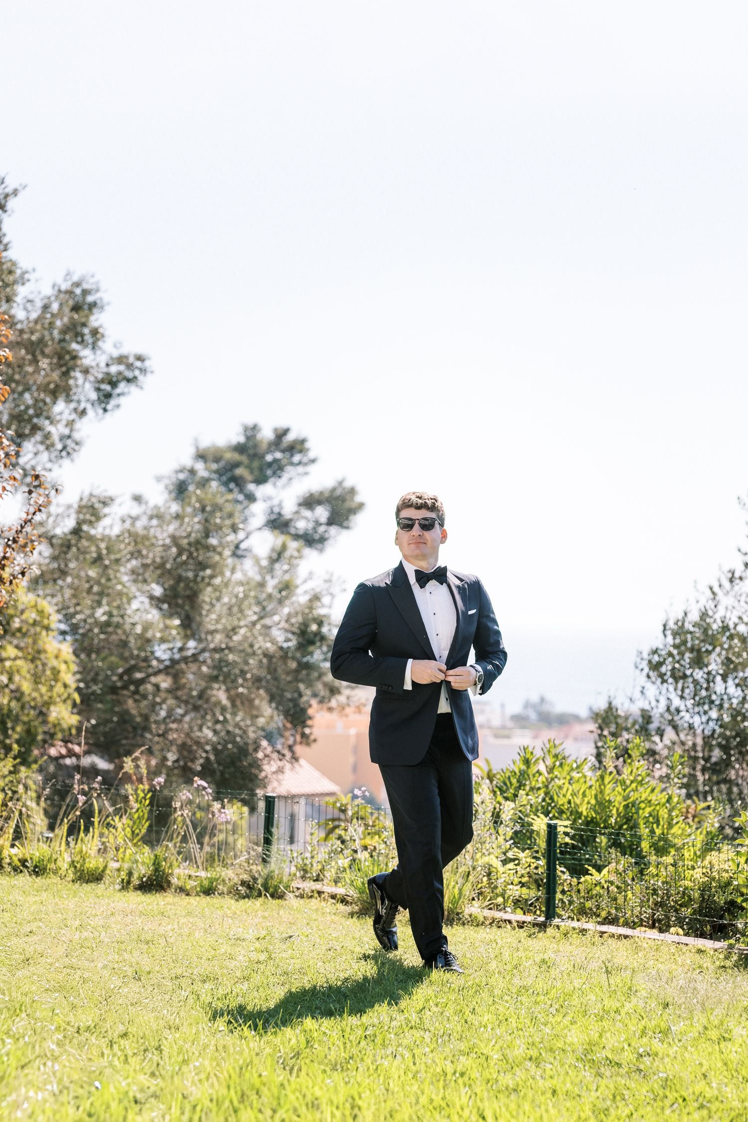 Groom preparation moments in Estoril before seaside wedding in Portugal