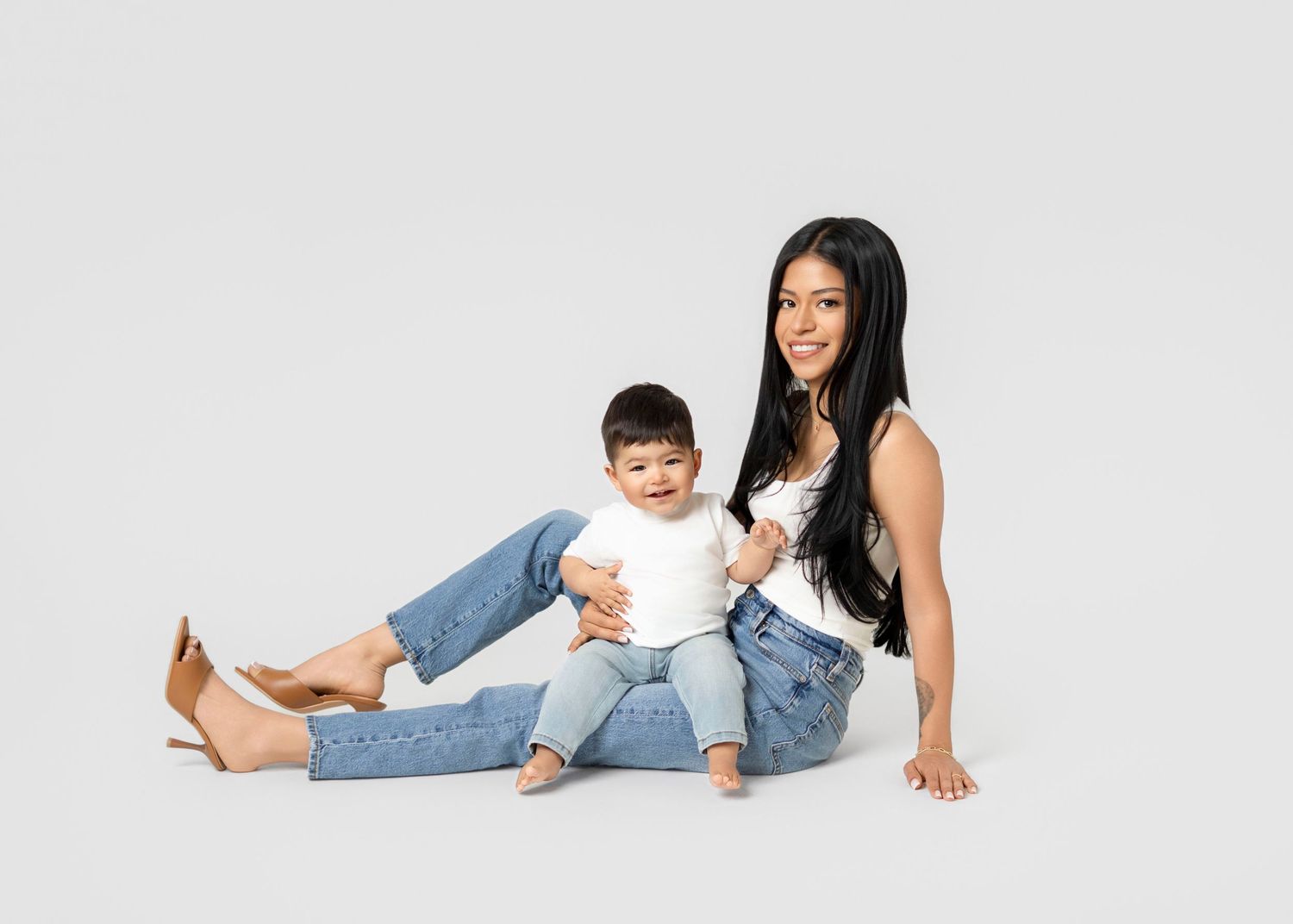 Minimalist family photography session in Covina CA with mom and baby, clean white studio background and natural posing