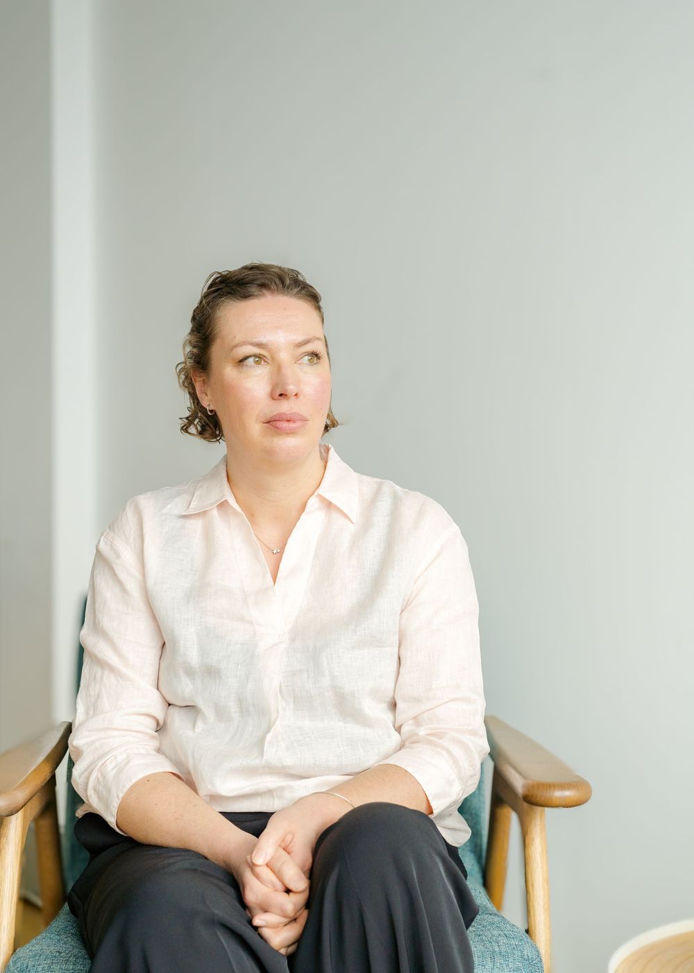 Relaxed portrait of a female business owner in natural light during a branding shoot in Kent