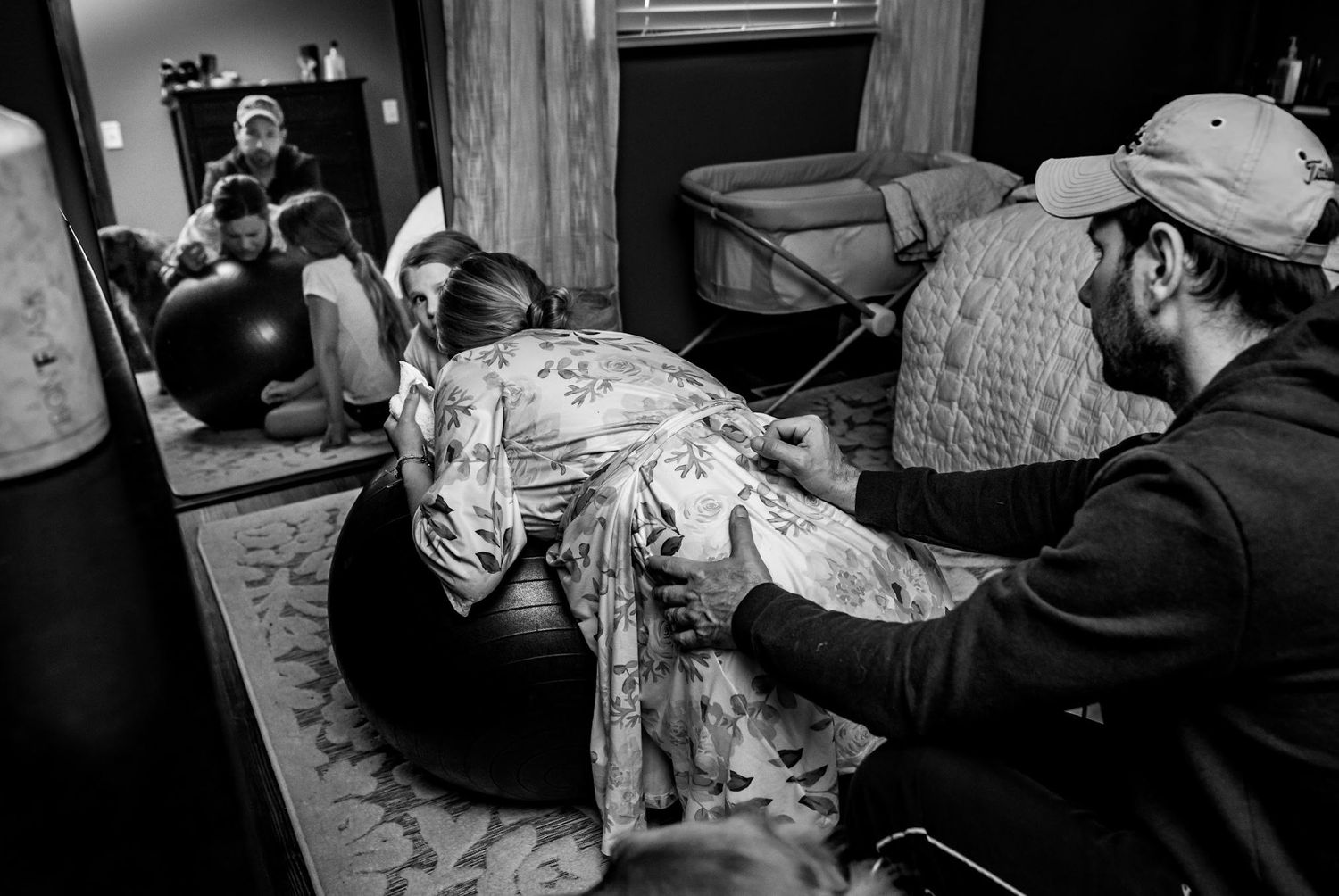 Black and white image of relaxation time on a bean bag chair in a cozy living room.