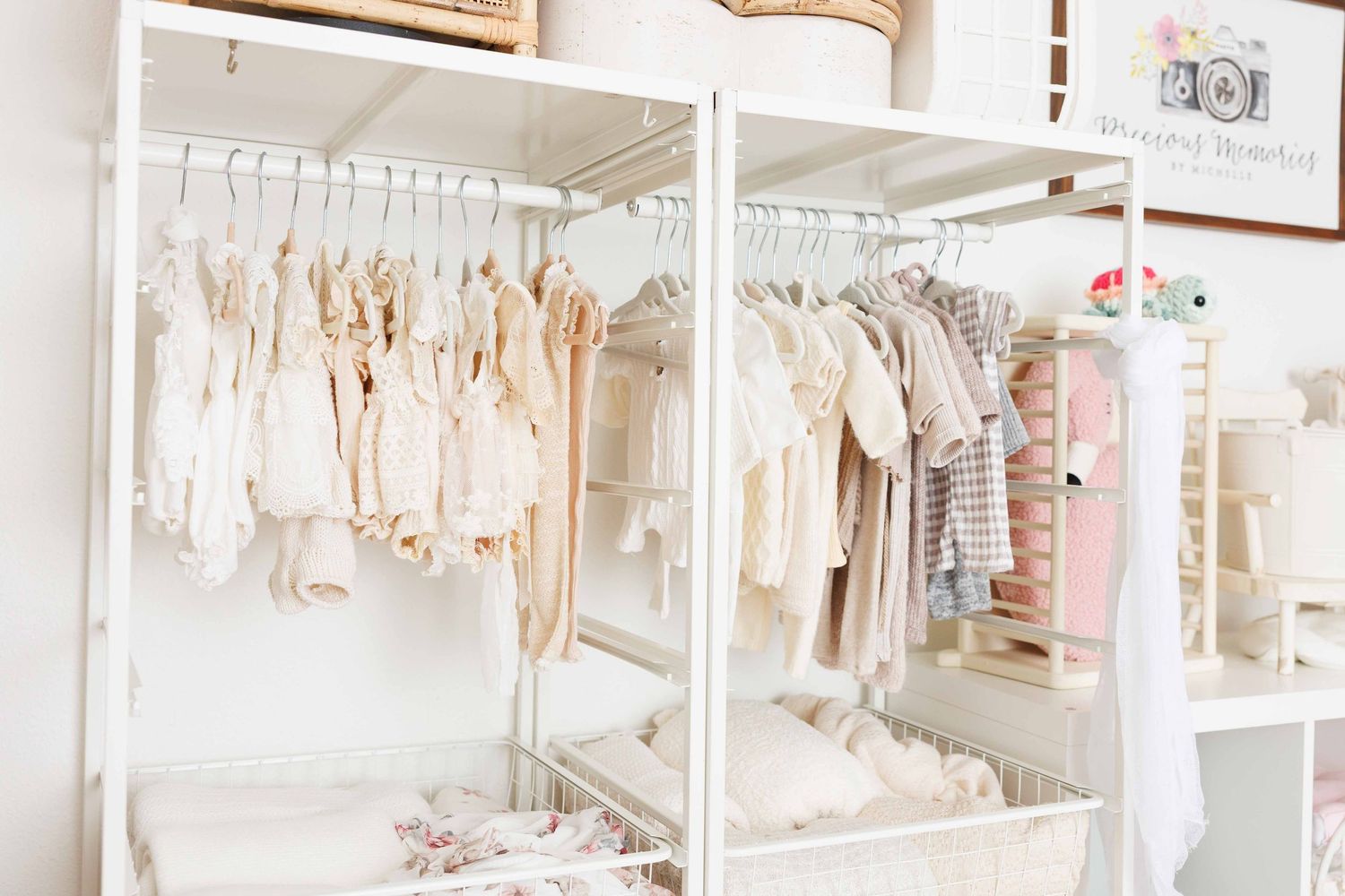 A boutique walk-in closet filled with pastel dresses on white racks, shelves, and a woven round rug on the floor.
