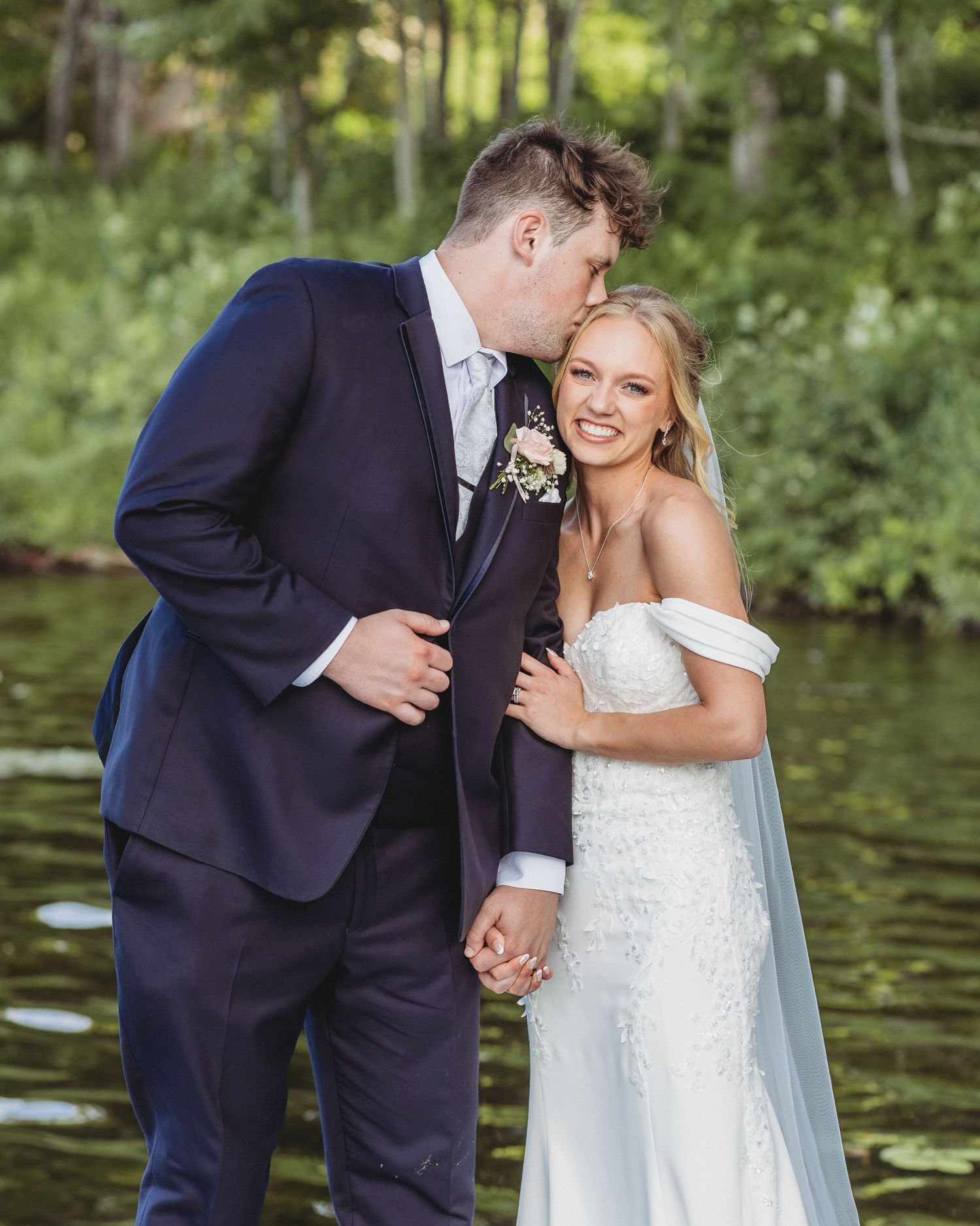 bridal couple photo by maine photographer down by the kennebec river at maine wedding venue in skowhegan