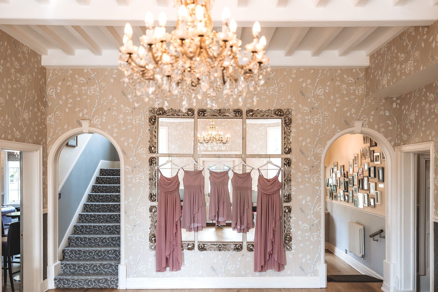 Bridesmaid dresses hung inside the interior of the entrance of Kelham House