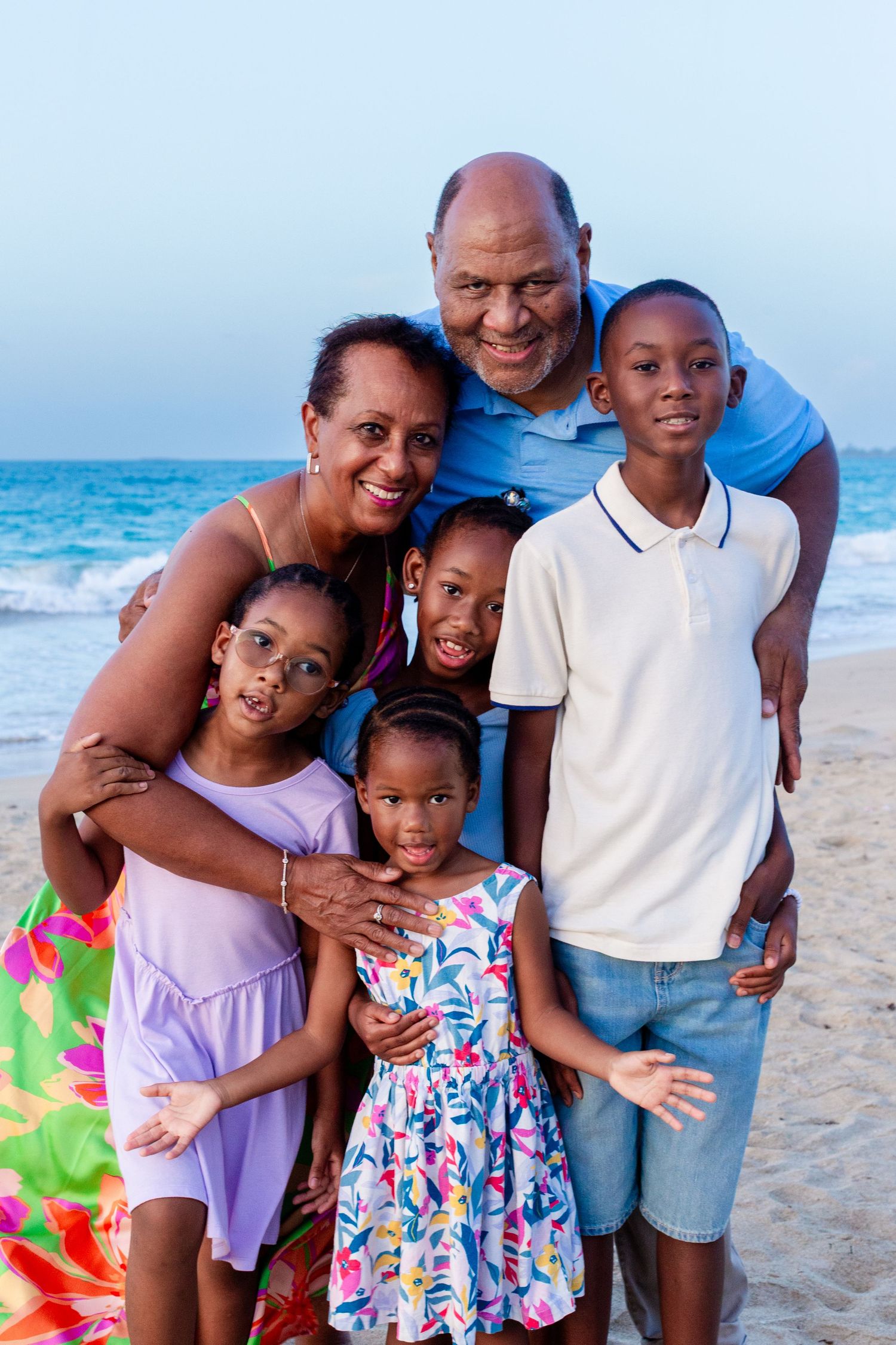 Family portrait. Grandparents and four grandkids on the beach in Isla Verde, Carolina, Puerto Rico.