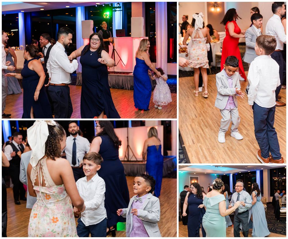Guests of all ages dance and celebrate joyfully on the wedding reception dance floor.