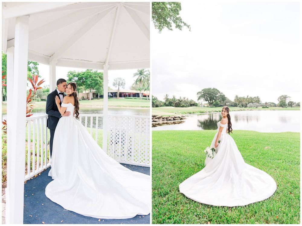 Bride and groom share a tender moment under a white gazebo beside a serene pond at a lush outdoor wedding venue.