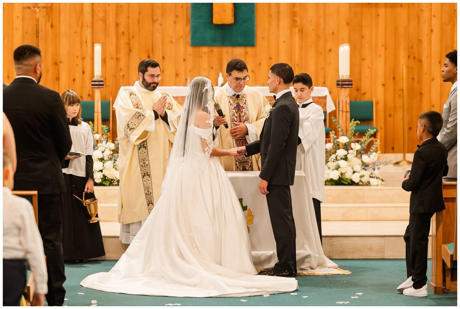 Bride and groom exchanging vows at church altar during traditional wedding ceremony.