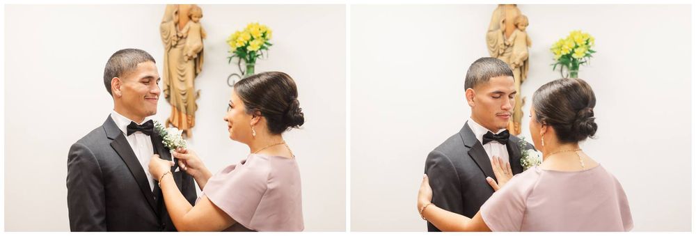 Mother pinning boutonniere on groom in tuxedo before wedding ceremony.