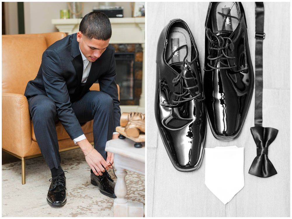 Groom in black suit tying patent leather dress shoes, with bow tie and white pocket square displayed nearby.