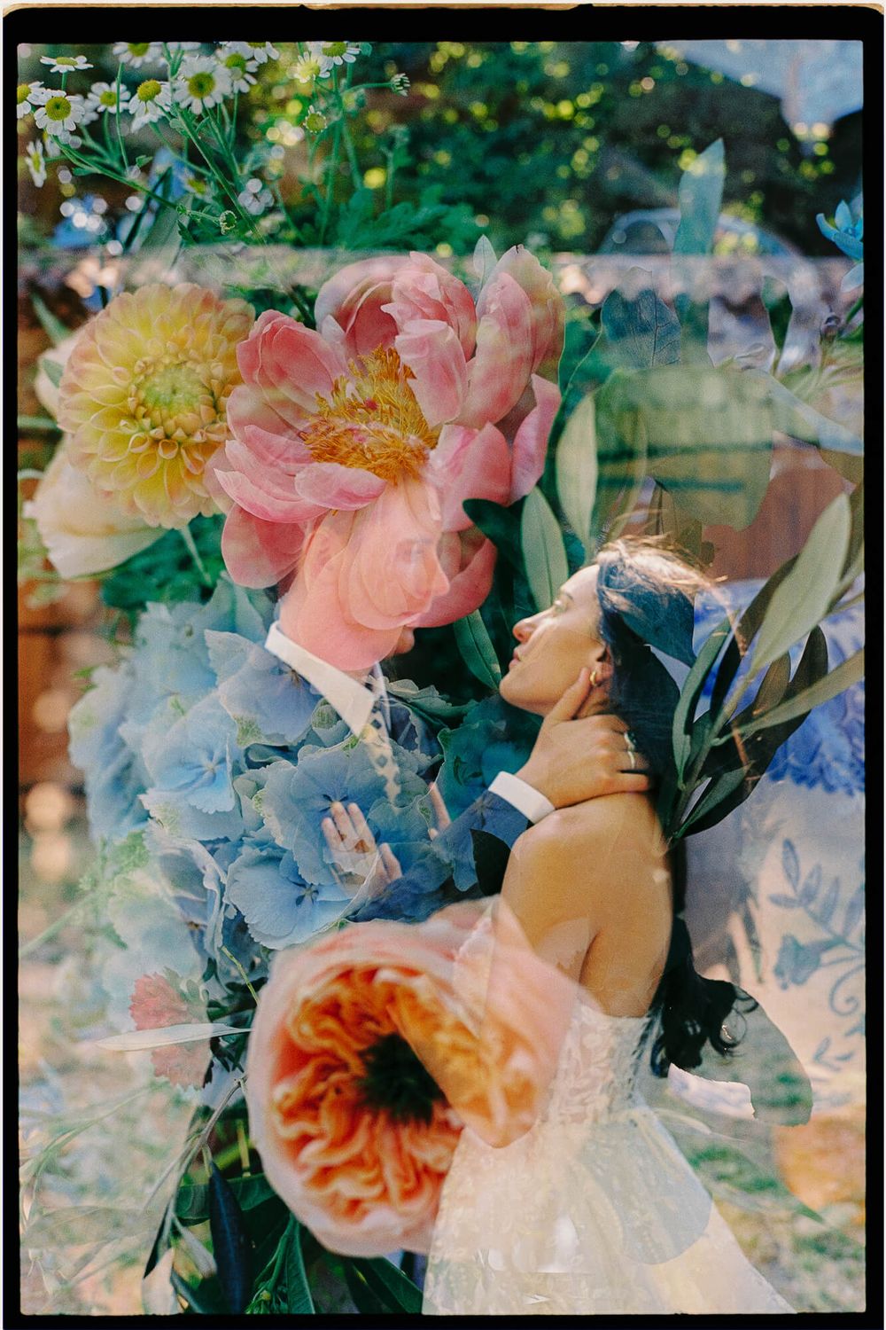 Double exposure wedding photo blending couple embracing with vibrant pink peonies and blue hydrangeas in dreamy floral composition.