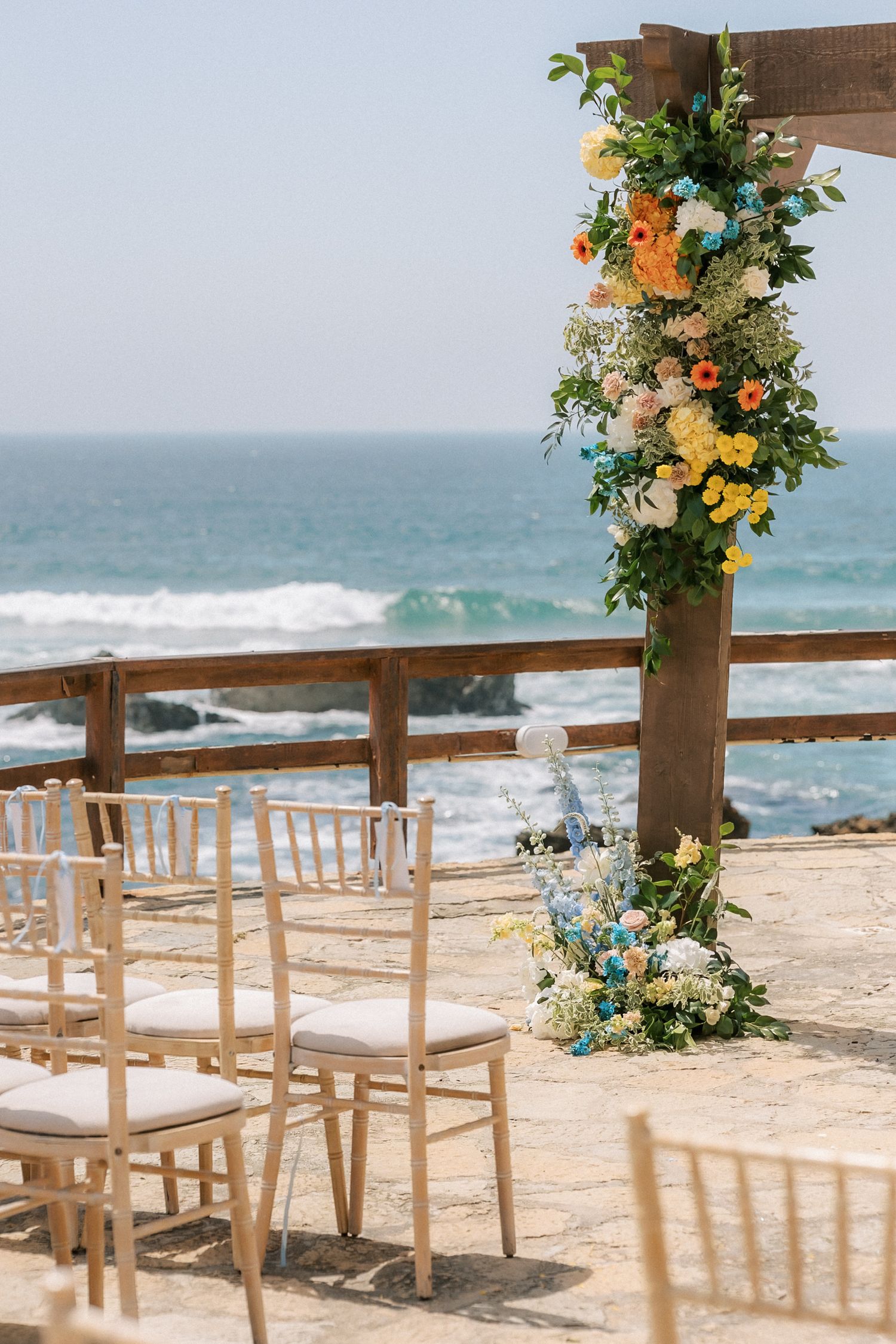 Oceanfront wedding ceremony setup overlooking the Atlantic Ocean at Arriba by the Sea, one of Portugal's most spectacular destination weddin