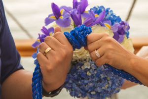 Close-up of couples tieing the knot. Shot By Zeus Holbrook San Diego Wedding Photographer