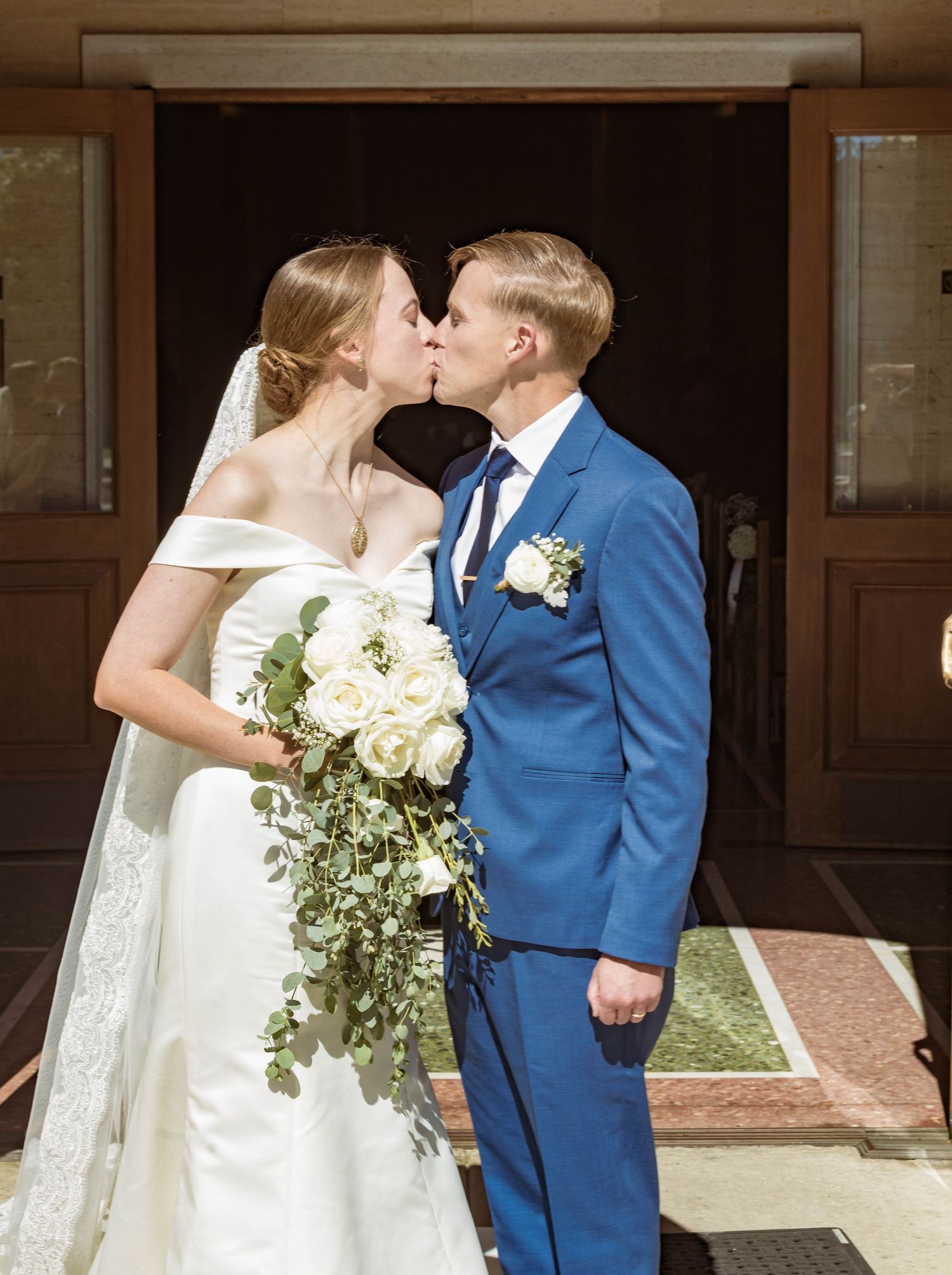 Zeus Holbrook | San Diego Wedding Photographer capturing a newly wed couples first kiss after the ceremony