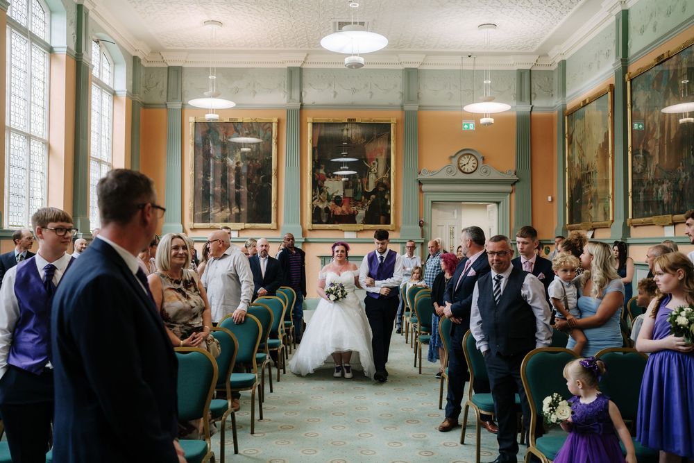 Bride walking down the aisle Corn Street Registry Office Wedding, Bristol.