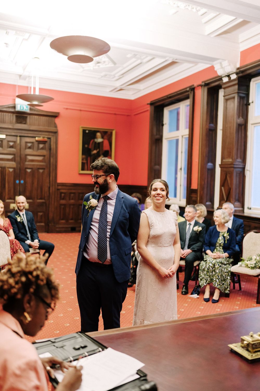 Couple smiling during civil wedding ceremony in Corn Street Registry Office Wedding, Bristol