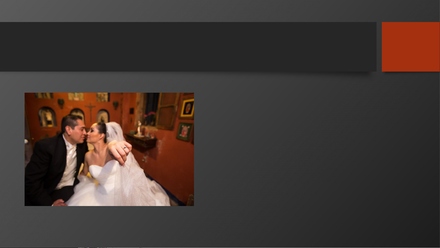 A bride and groom share a romantic moment at their wedding reception in an elegantly decorated room.