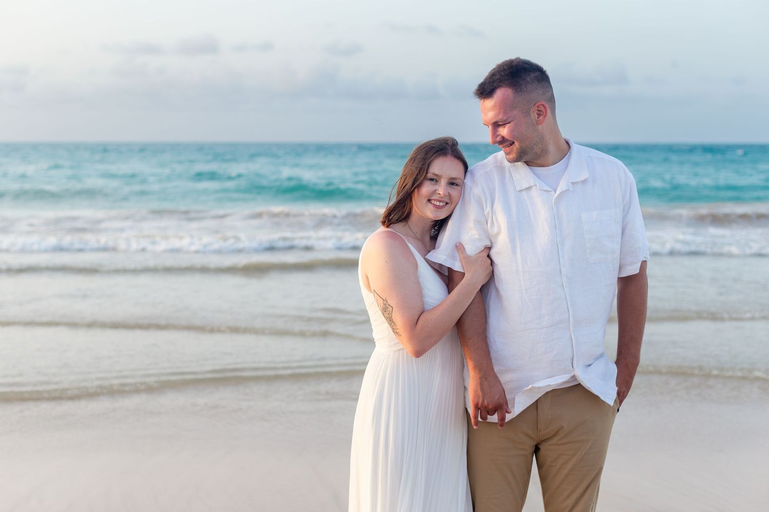 Couples portrait on the beach in Isla Verde, Carolina, Puerto Rico.