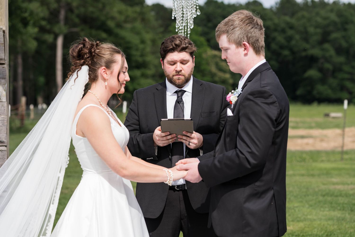 bride and groom exchange vows