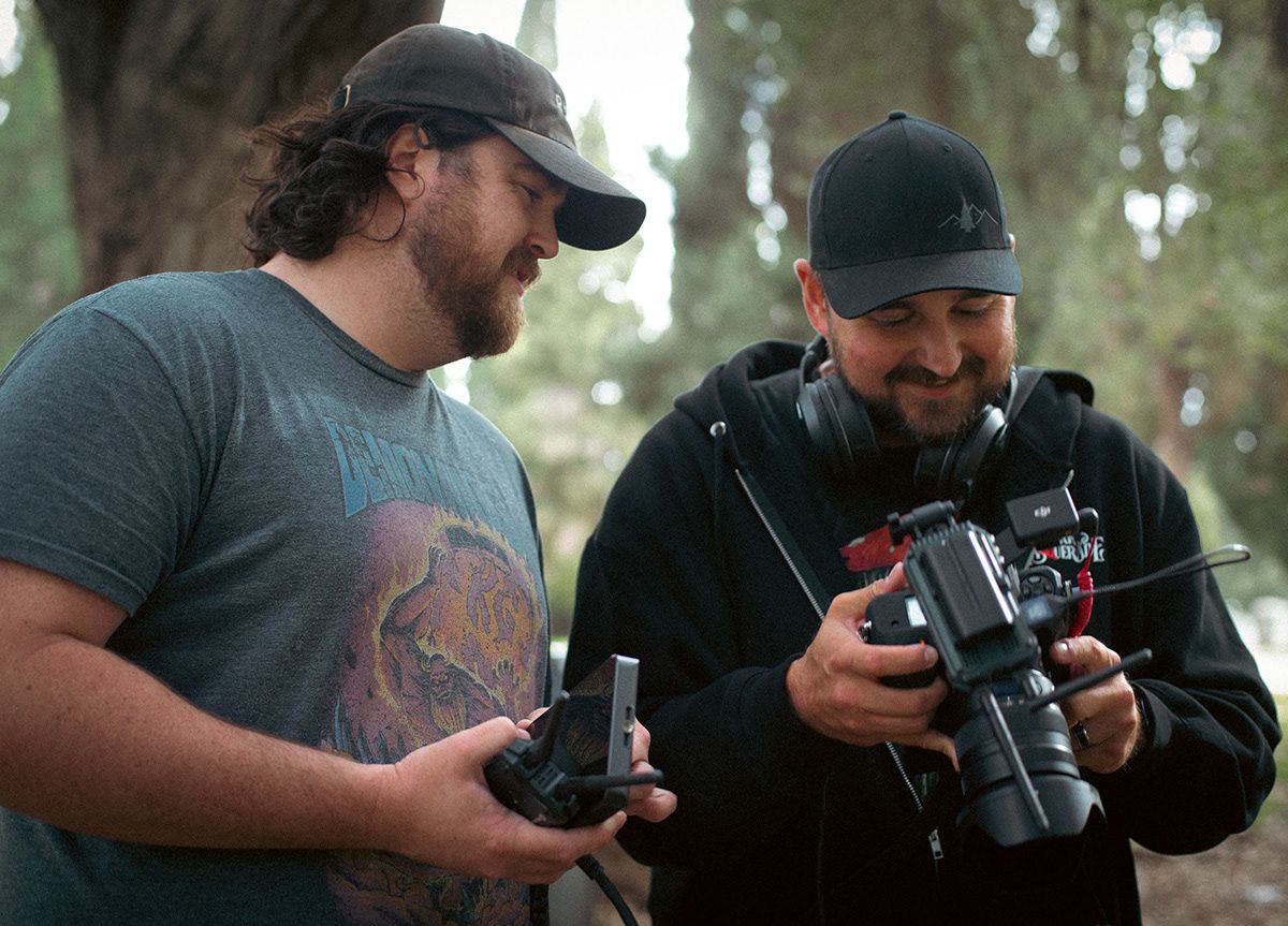 Chris Cornish, photographer, on the set for the short film I-16 talking to Dillon Sisson, Director
