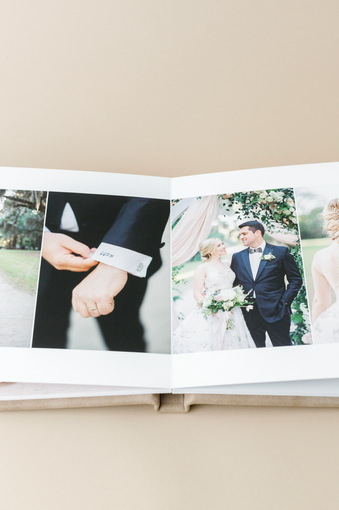 Open wedding photo album displaying bride and groom portrait alongside close-up of groom adjusting cufflinks.