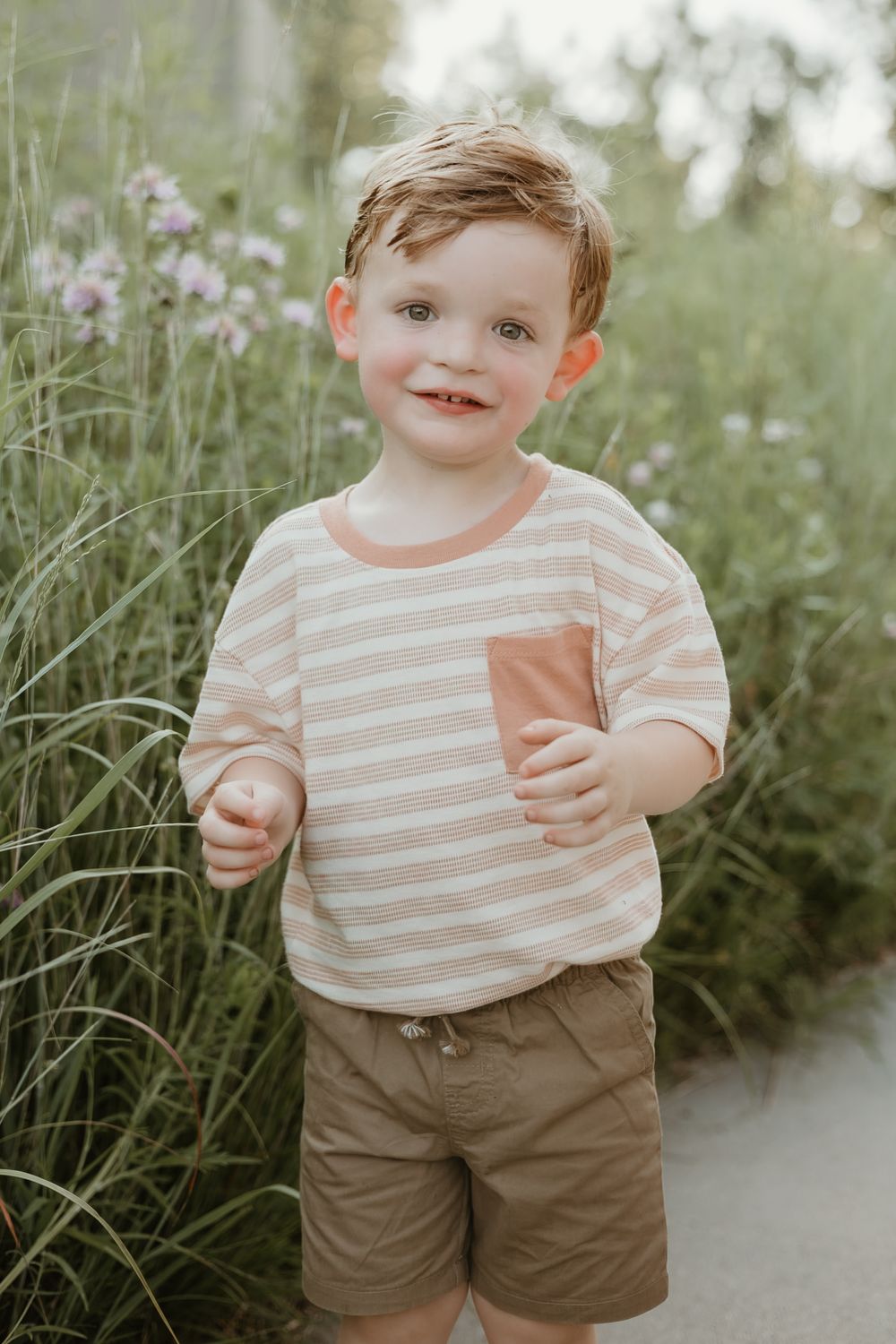 happy boy in flowers
