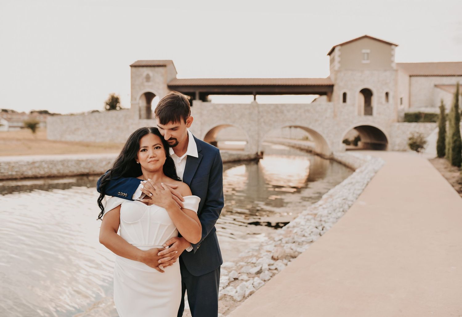 Elegant Dallas engagement photography with sophisticated wardrobe and modern architectural scenery