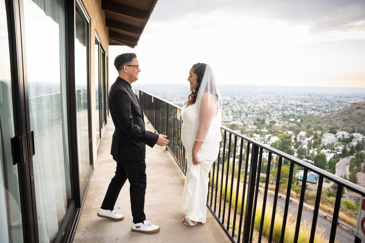 Melissa and Sean during their first look on a balcony at their wedding.