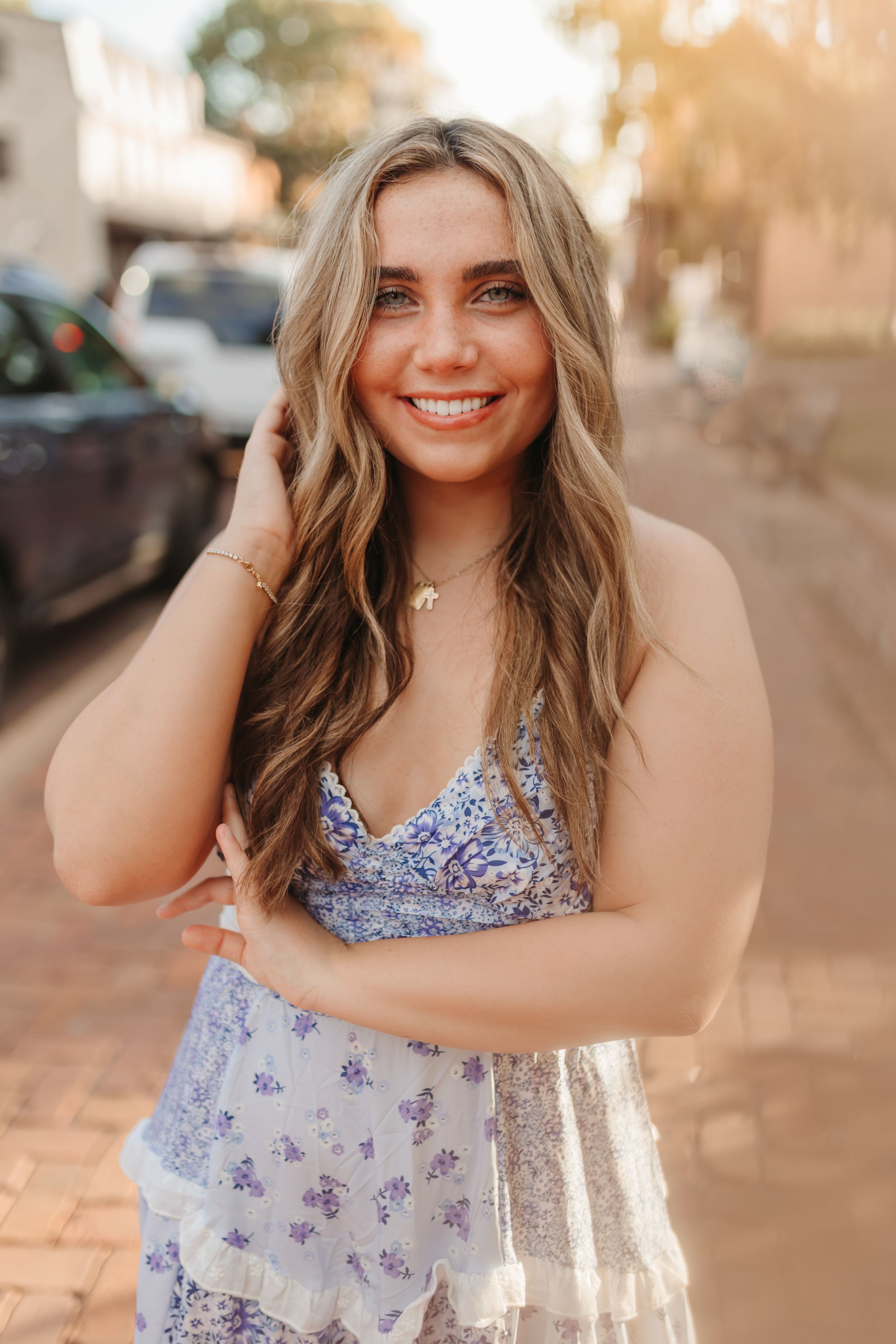 A series of outdoor portrait photos showing someone in a floral sundress during golden hour lighting.