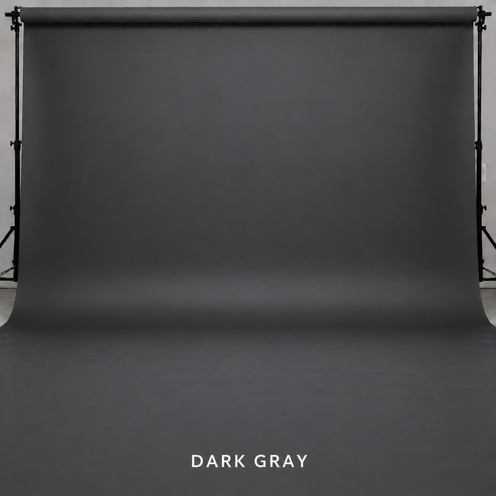 Dark gray seamless photography backdrop on a studio stand, perfect for professional portrait and product photography.