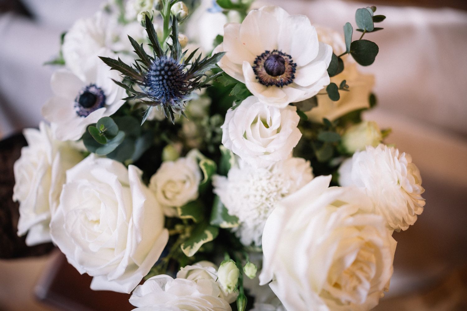 White roses and thistle by Fleurish for a Post Hotel wedding in Lake Louise