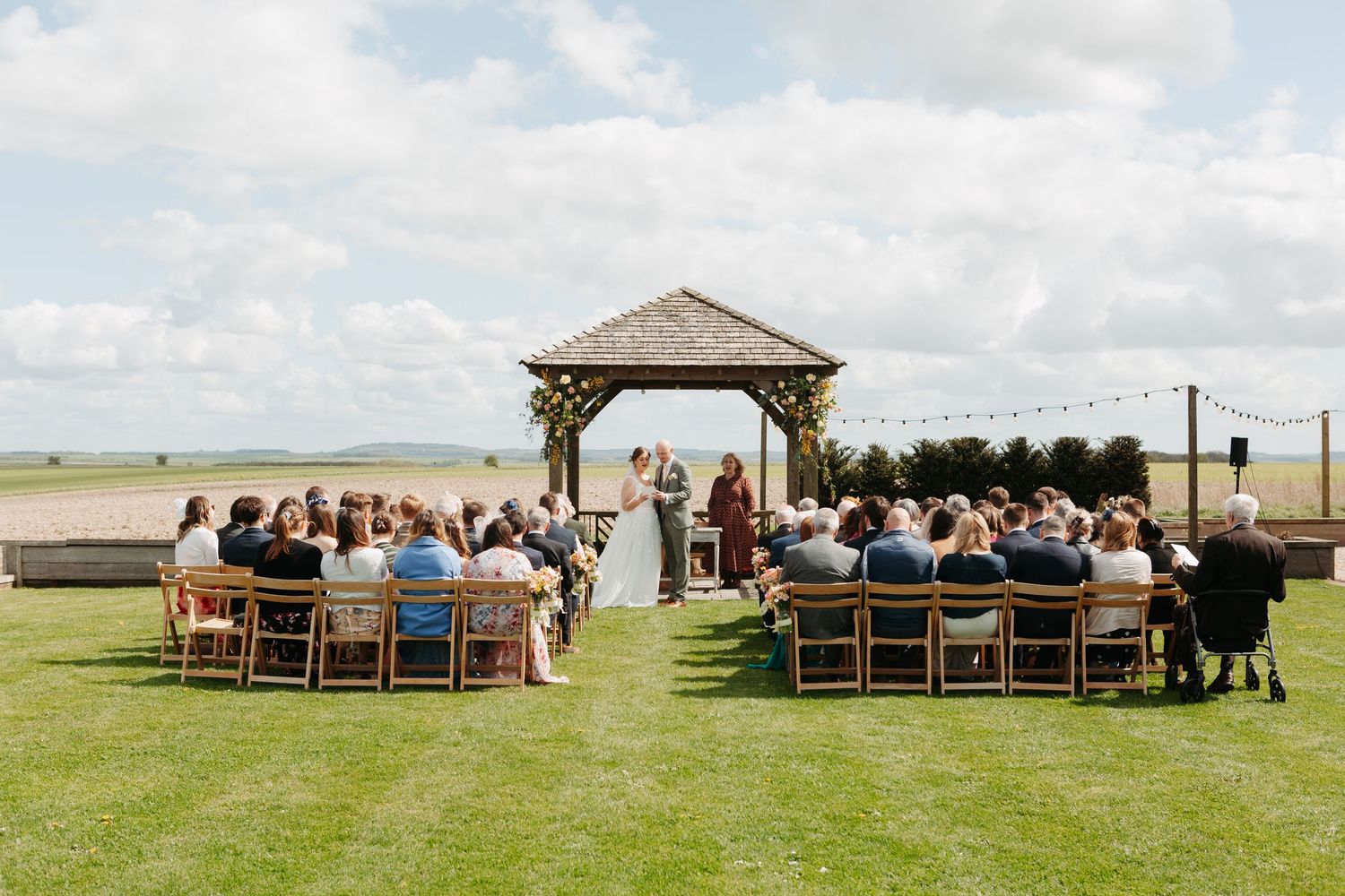 Outdoor wedding ceremony at Chalk Barn, Wiltshire