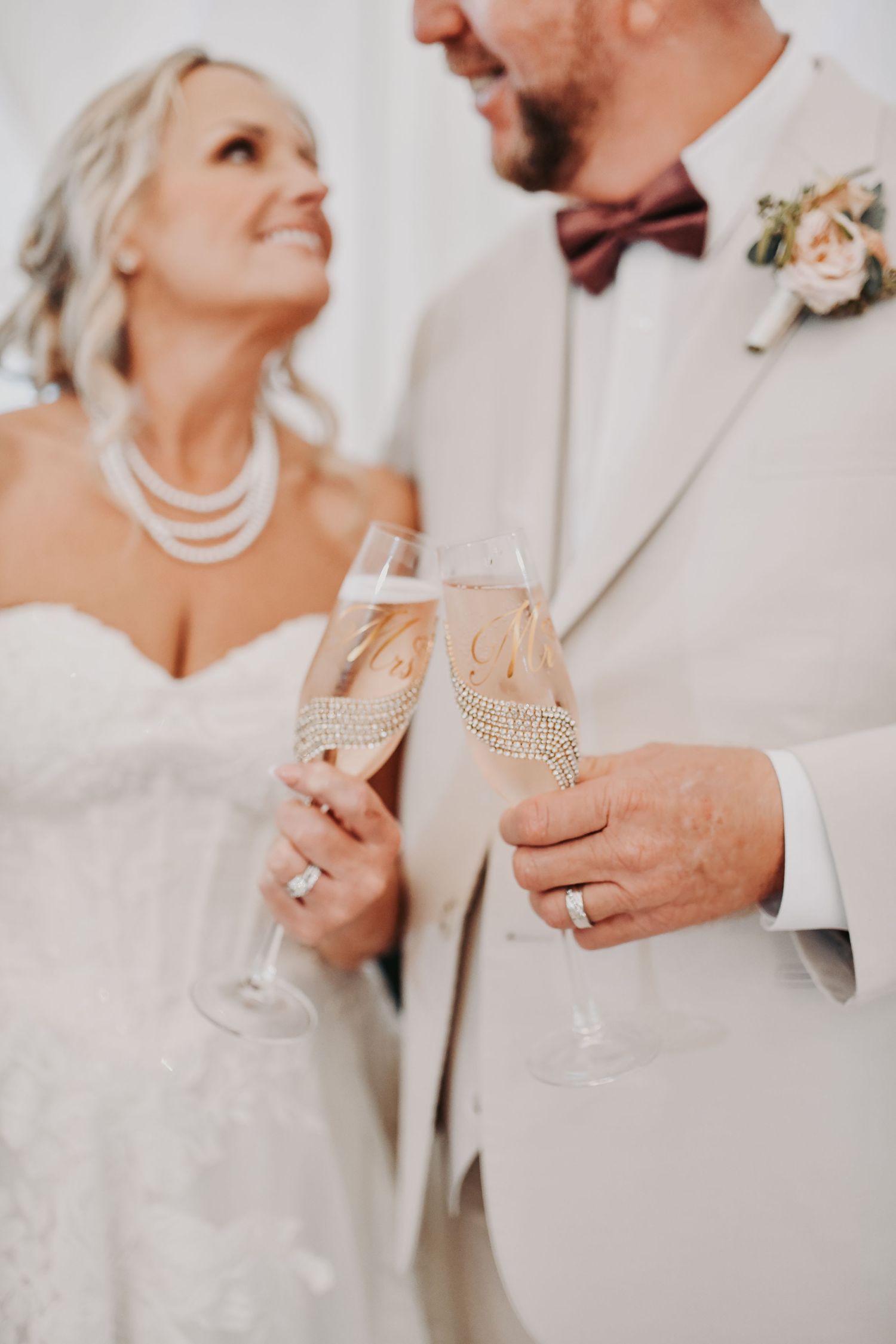 Bride and groom laughing together during their wedding reception